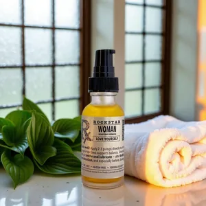 Rockstar Woman ~ Hemp Free intimate & body oil on a sunny windowsill beside a folded towel